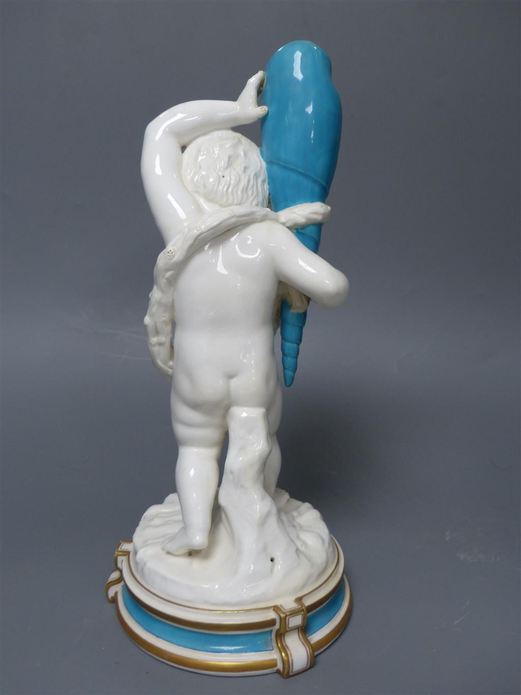 A large late 19th century French porcelain figure of Cupid, an English bone china cherub vase and a similar sweetmeat dish, tallest 3